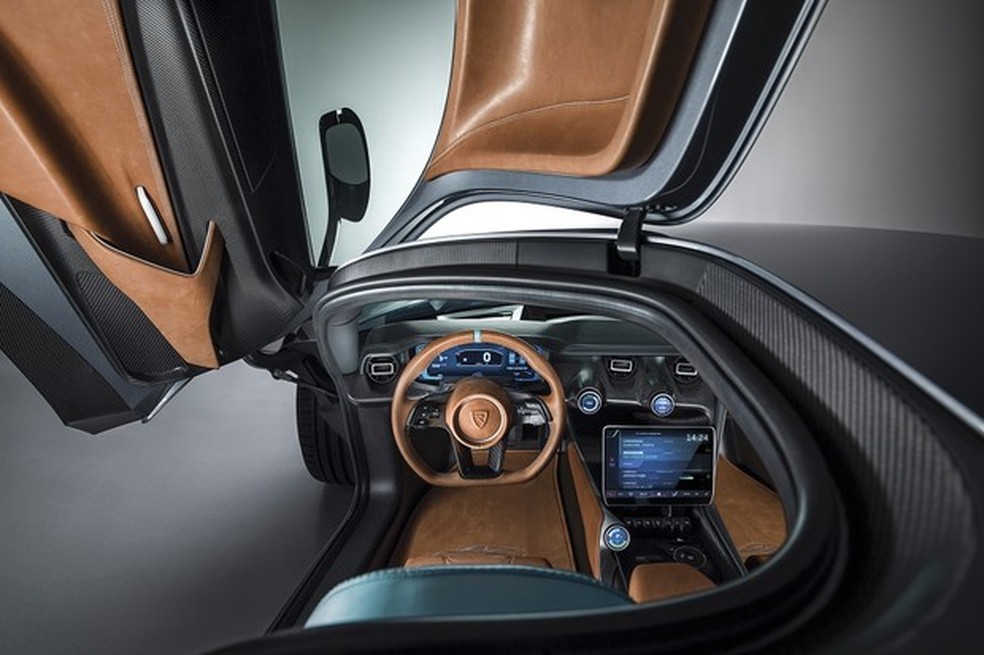O interior é minimalista com poucos botões e a central multimídia tem forma de tablet (Foto: Divulgação) — Foto: Auto Esporte